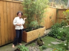 Jen in her garden with bamboo